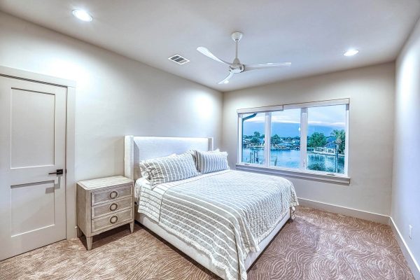 Zbranek and Holt Custom Homes Soft Modern Transitional Guest Bedroom 1 Overlooking Lake nd Pool