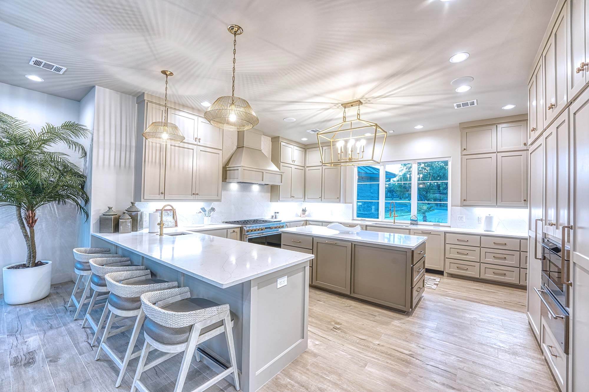 Zbranek and Holt Custom Homes Soft Modern Transitional Open Kitchen With View to Pool and Lake