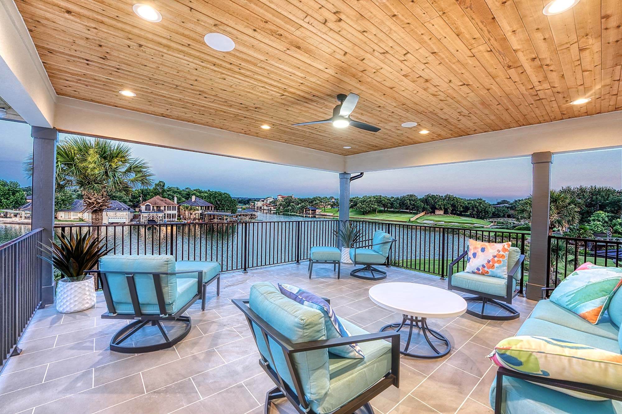 Zbranek and Holt Custom Homes Soft Modern Transitional Upper Covered Patio Overlooking Lake and Pool