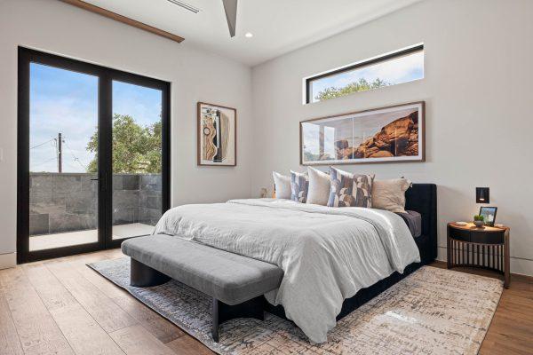 Zbranek Holt LakeLBJ Modern Luxury Lakehouse Bedroom FrenchDoors ScenicArt NaturalLight