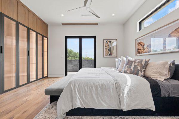 Zbranek Holt LakeLBJ Modern Luxury Lakehouse Bedroom FrenchDoors Wardrobe LinenBedding CalmAmbiance