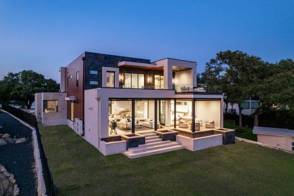 Zbranek Holt LakeLBJ Modern Luxury Lakehouse Elevated View Glass Walls Terrace Seating