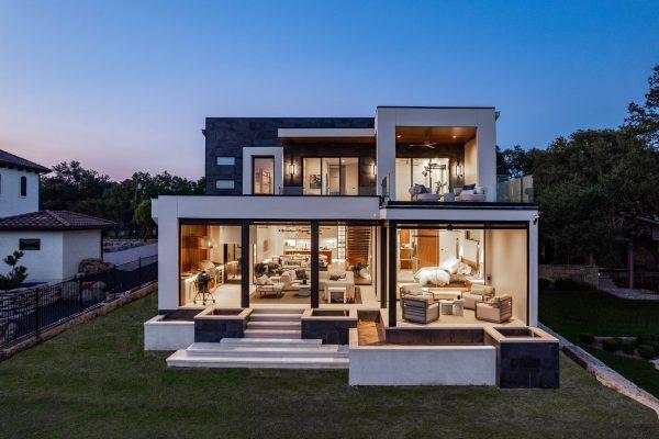Zbranek Holt LakeLBJ Modern Luxury Lakehouse Front Elevated View Glass Walls Open Living Spaces