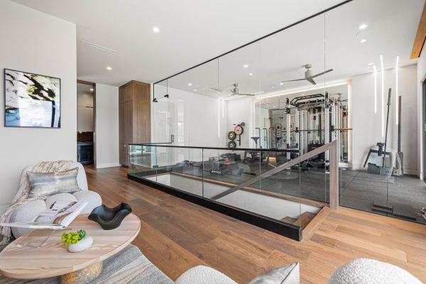 Zbranek Holt LakeLBJ Modern Luxury Lakehouse Home Gym Glass Enclosure Wood Flooring Reading Nook