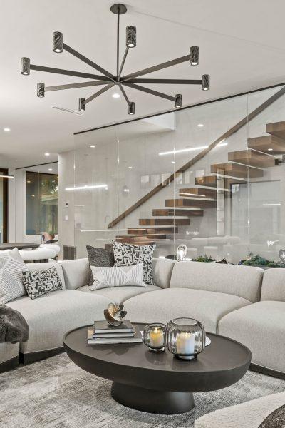 Zbranek Holt LakeLBJ Modern Luxury Lakehouse Living Room Sofa Coffee Table Floating Staircase