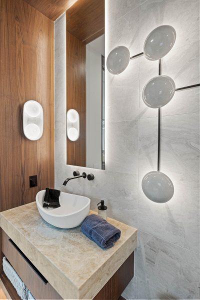 Zbranek Holt LakeLBJ Modern Luxury Lakehouse Powder Room Stone Vanity Wall Lighting