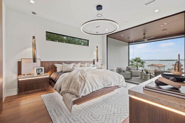 Zbranek Holt LakeLBJ Modern Luxury Lakehouse Primary Bedroom Suite Floating Bed Lake View Indoor Outdoor Living