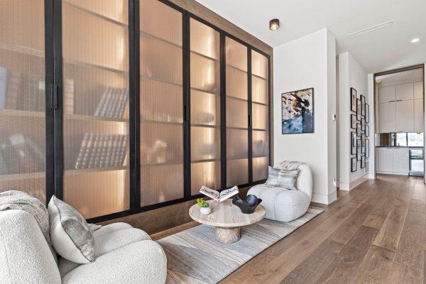 Zbranek Holt LakeLBJ Modern Luxury Lakehouse Reading Nook Built in Bookcase Frosted Glass Cozy Seating