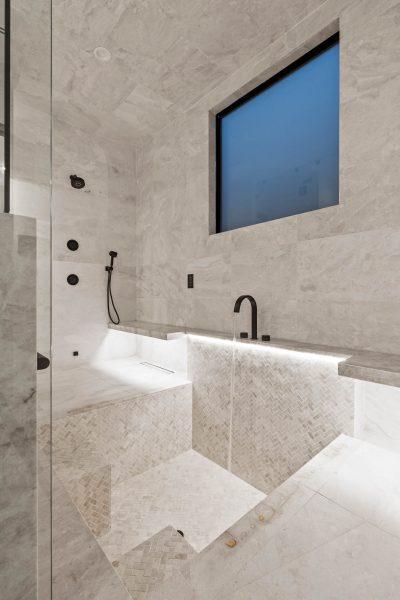 Zbranek Holt LakeLBJ Modern Luxury Lakehouse Spa Shower Wet Room Tiled Seating