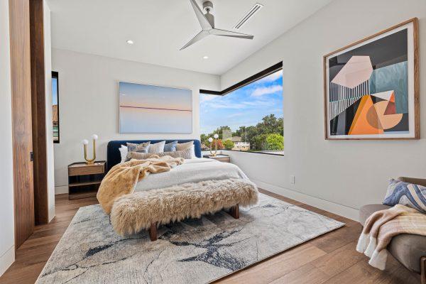 Zbranek Holt Modern Luxury Lakehouse Corner Window Bedroom Fur Bench Abstract Art View