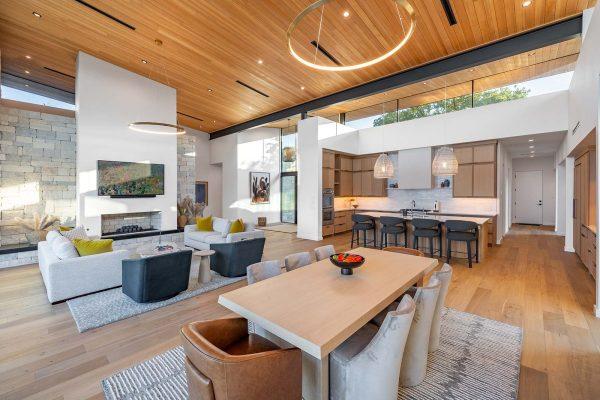 Modern Organic Lakehouse Great Room Stone Fireplace Wood Ceiling Kitchen Zbranek and Holt Custom Homes