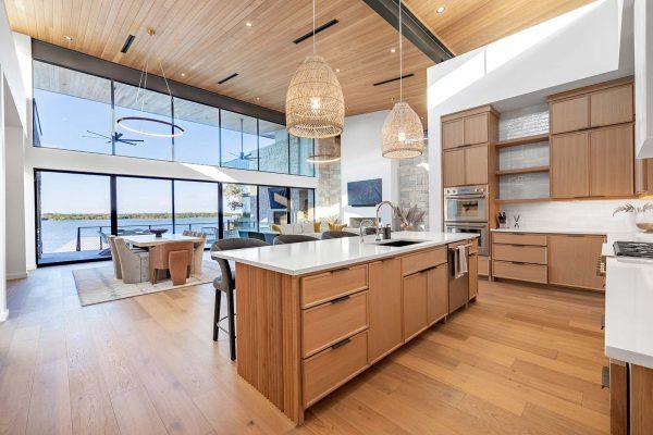 Modern Organic Lakehouse Kitchen Island Wood Cabinetry Waterfront Views Zbranek and Holt Custom Homes