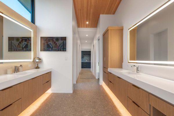 Modern Organic Lakehouse Master Bathroom Dual Vanity Backlit Mirrors Wood Ceiling Zbranek and Holt Custom Homes