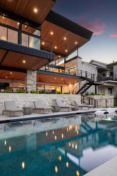 Modern Organic Lakehouse Poolside Outdoor Living Stone Wood Zbranek and Holt Custom Homes