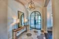 Zbranek-and-Holt-Custom-Homes-Cantera-Iron-Front-Door-Entry-Tile-Floor-Contemporary-Lighting
