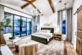 Zbranek-and-Holt-Custom-Homes-Lake-Front-Casual-Modern-Master-Bedroom-With-Glass-Wall-Lake-View-and-Walk-Out-Patio