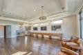 Zbranek-and-Holt-Custom-Homes-Game-Room-Shuffle-Board-Bar-TV-wall-Wood-Floor