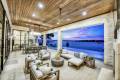 Zbranek-and-Holt-Custom-Homes-Lake-Front-Casual-Modern-Outdoor-Living-Area-Overlooking-Pool-and-Lake-View
