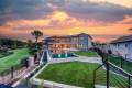 Zbranek-and-Holt-Custom-Homes-Soft-Modern-Transitional-Exterior-Overlooking-Pool-and-Applehead-Island-Lake-View