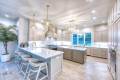 Zbranek-and-Holt-Custom-Homes-Soft-Modern-Transitional-Open-Kitchen-With-View-to-Pool-and-Lake