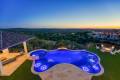 Zbranek-and-Holt-Custom-Homes-Backyard-Firepit-Pool-Sunset